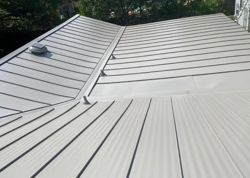Solar attic fan installed on a metal roof for Roof Ventilation in Mount Pleasant